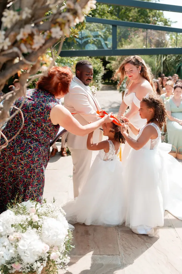 Wedding ribbon ceremony with the couple's child