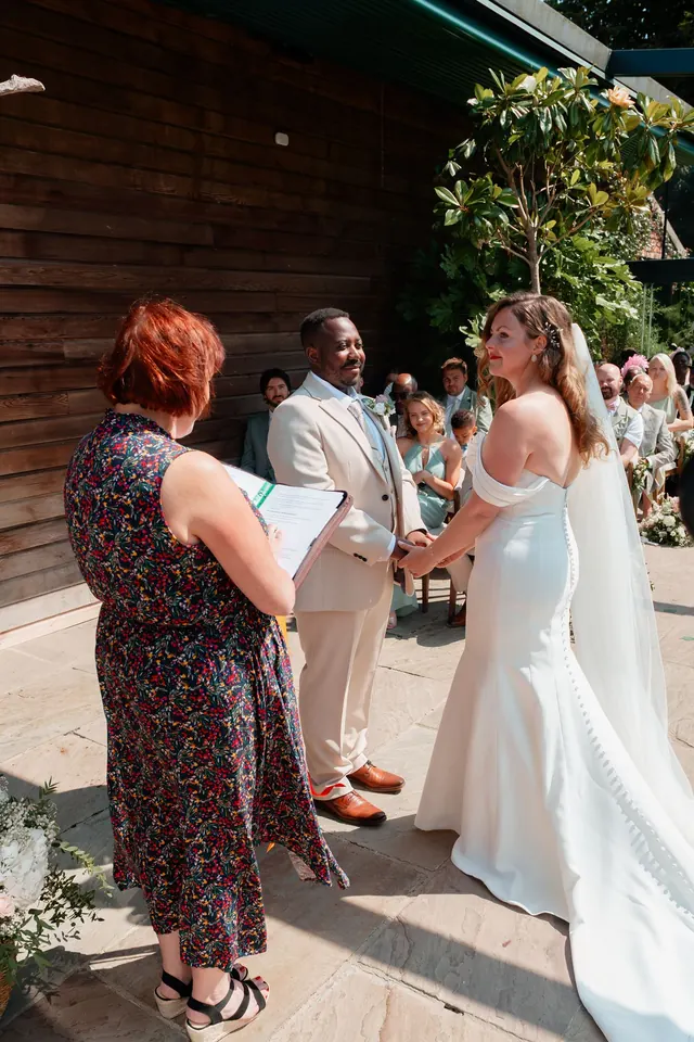 Newly married couple celebrating outdoors